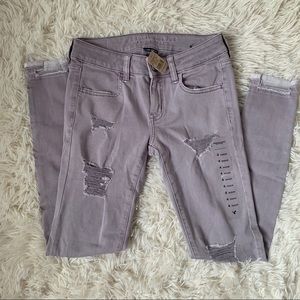 NWT American Eagle purple distressed jeggings 4